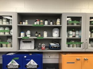 science lab chemicals cabinet with hot plate.