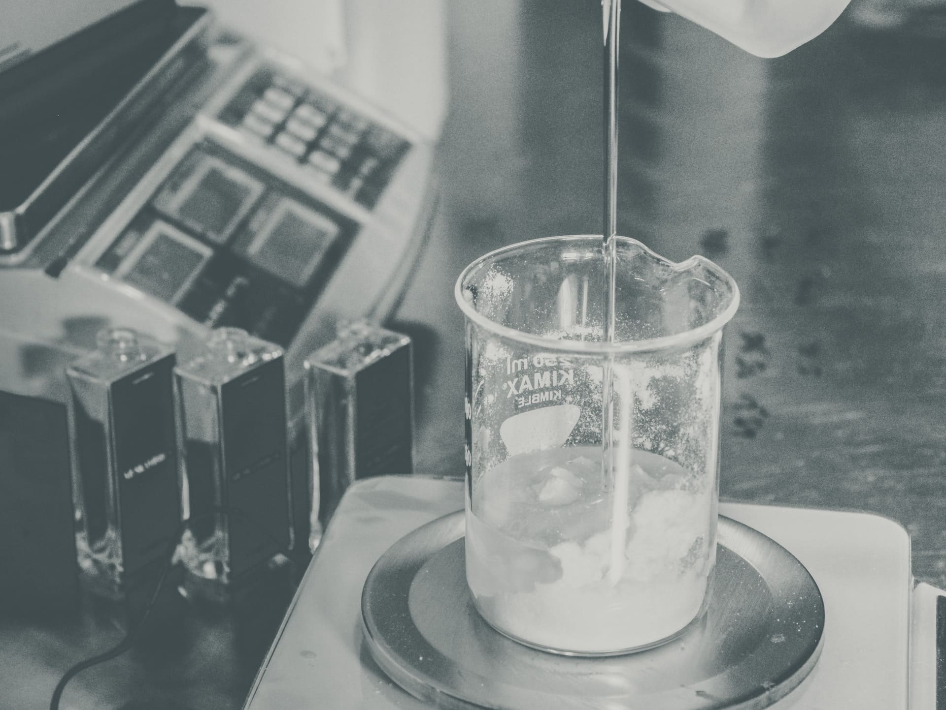 pouring liquid into container on hot plate