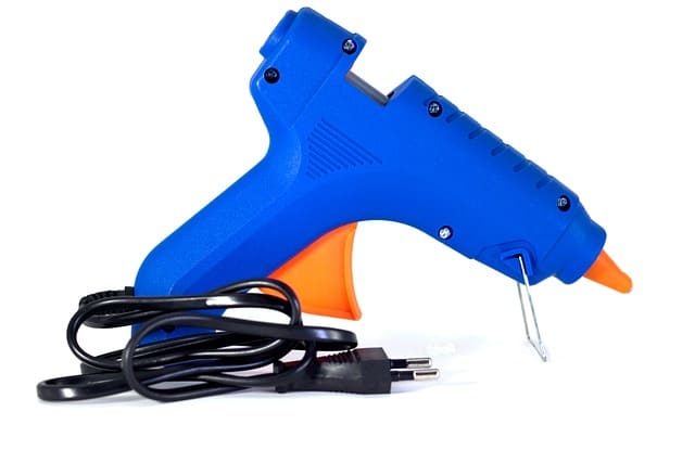 blue and orange glue gun with cord
