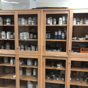 Science lab cabinets with chemicals. View during a safety inspection.