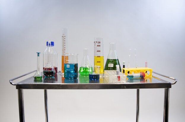 a table with different colored liquids
