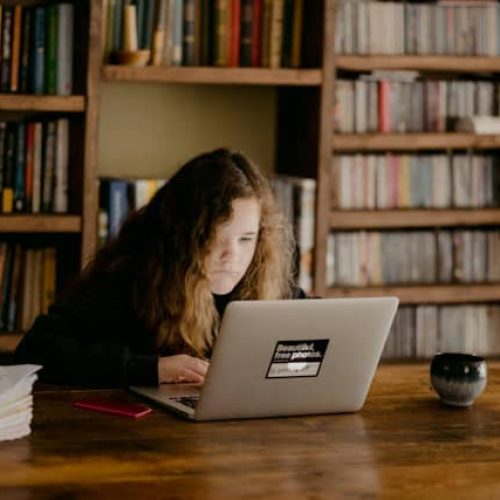 young student working on a laptop
